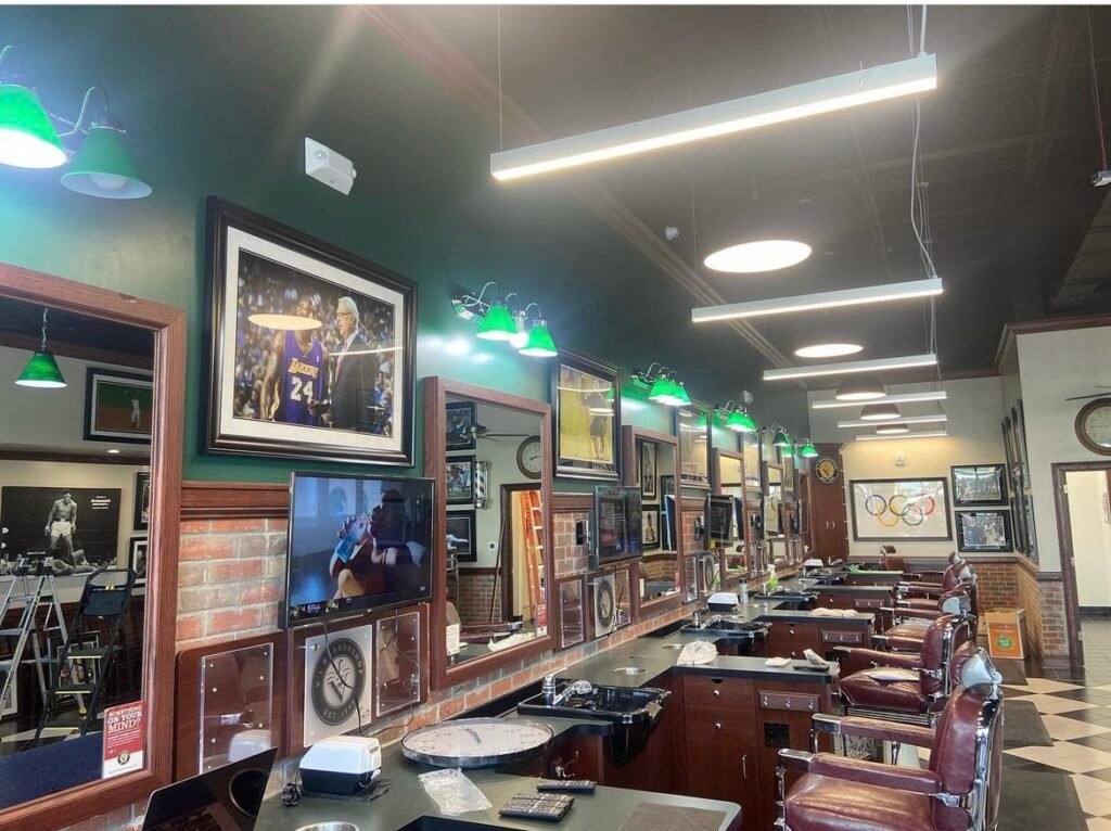 Barbershop with sport pictures and posters installed.