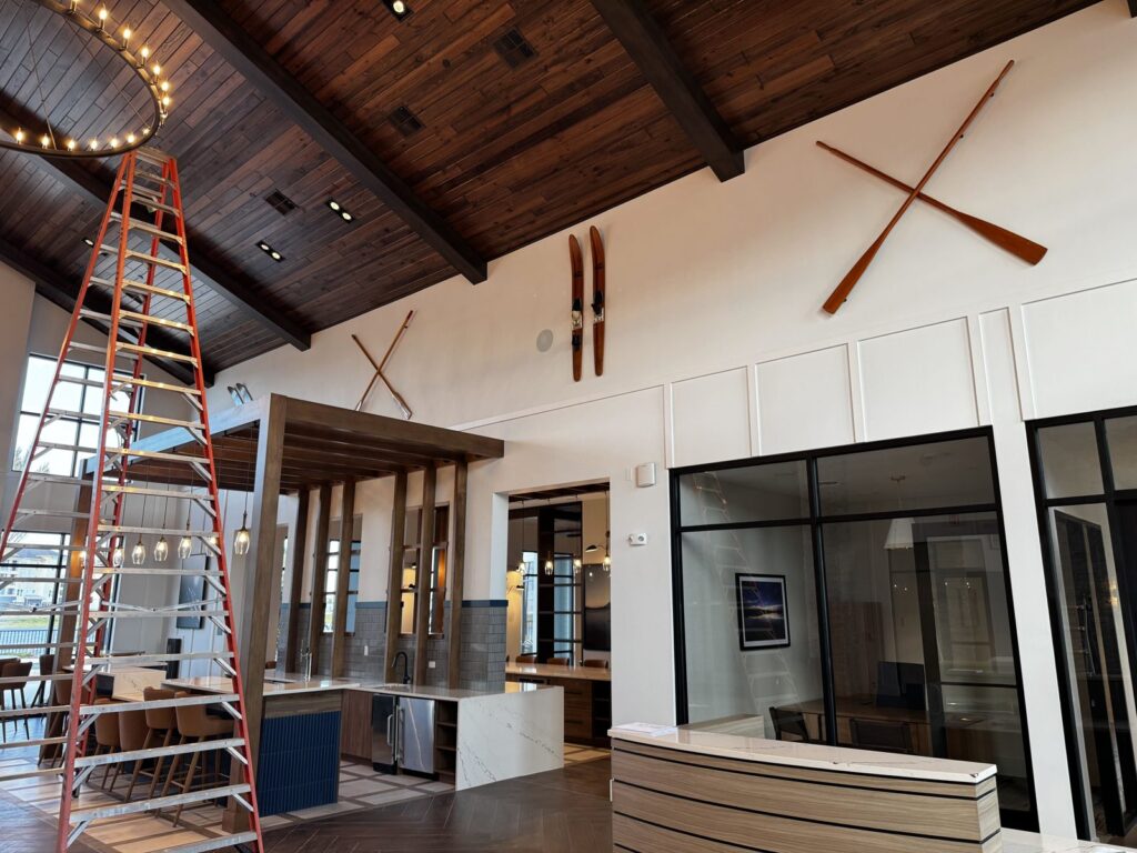 Oars and vintage water skis hung high on a vaulted clubhouse wall